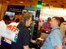 A couple of Hamvention visitors enjoy themselves in the midst of the crowd. [Steve Ford, WB8IMY, photo]